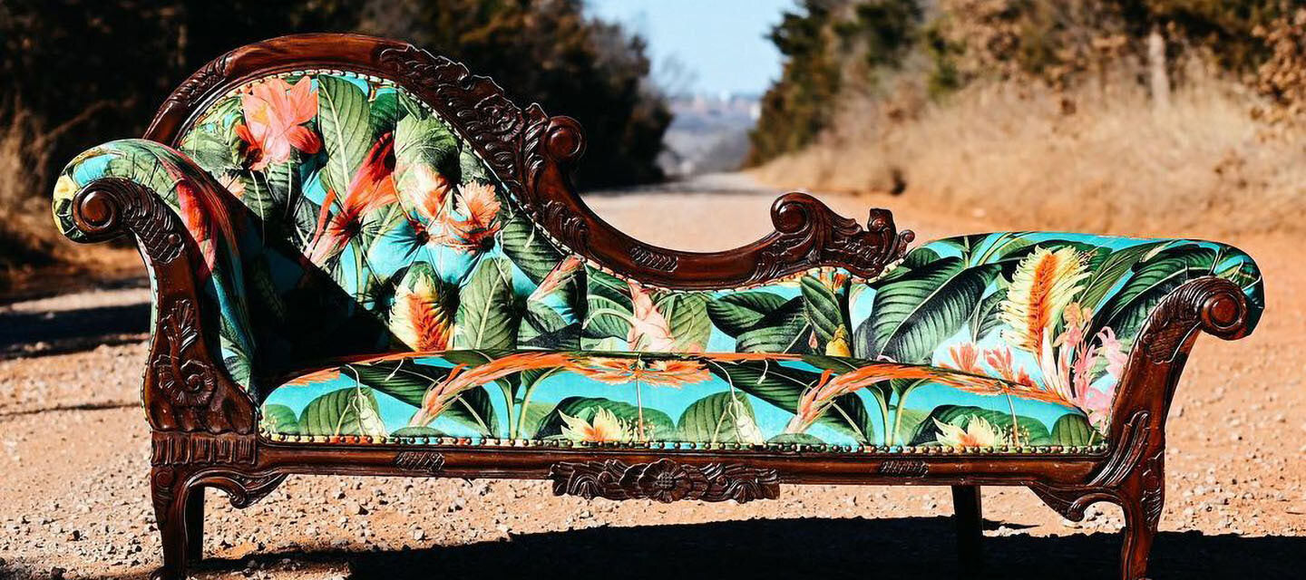 Chaise with new tropical apolstery on gravel road