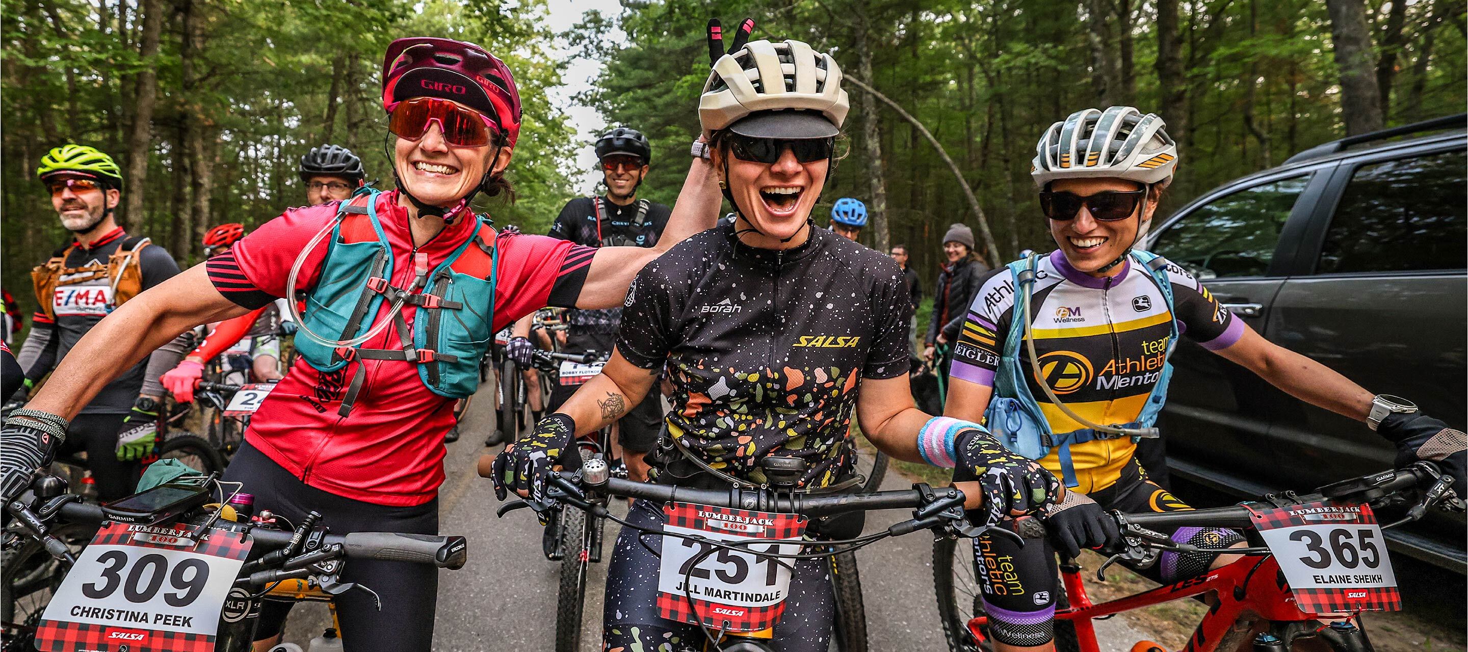 Jill smiling with friends at start line of Lumberjack 100 race