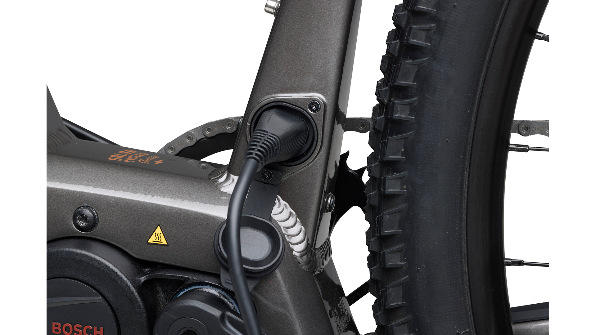 Salsa Tributary Ebike Apex Front Suspension in gray Bosch motor charging port plugged in on white background